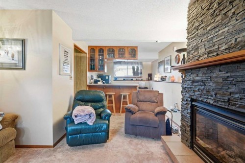 5616 45Th Street, Innisfail, AB - Indoor Photo Showing Other Room With Fireplace