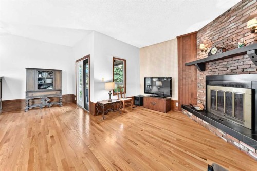 3 43 Avenue Close, Lacombe, AB - Indoor Photo Showing Living Room With Fireplace