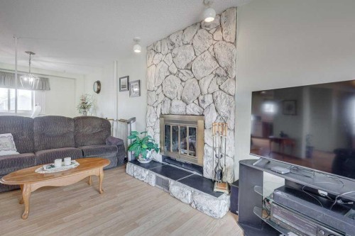 165 Greig Drive, Red Deer, AB - Indoor Photo Showing Living Room With Fireplace