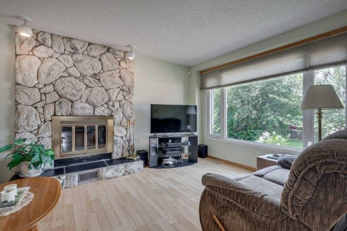 165 Greig Drive, Red Deer, AB - Indoor Photo Showing Living Room With Fireplace