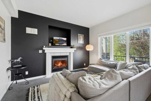 21 Regatta Way, Sylvan Lake, AB - Indoor Photo Showing Living Room With Fireplace