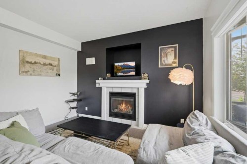 21 Regatta Way, Sylvan Lake, AB - Indoor Photo Showing Living Room With Fireplace