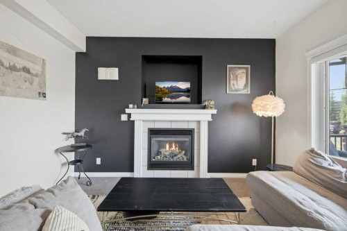 21 Regatta Way, Sylvan Lake, AB - Indoor Photo Showing Living Room With Fireplace