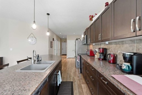 707 Elk Street, Sunbreaker Cove, AB - Indoor Photo Showing Kitchen With Double Sink
