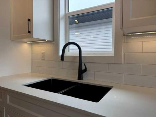 85 Gray Close, Sylvan Lake, AB - Indoor Photo Showing Kitchen With Double Sink