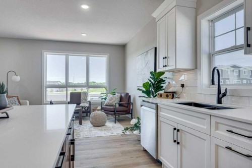 83 Gray Close, Sylvan Lake, AB - Indoor Photo Showing Kitchen With Double Sink
