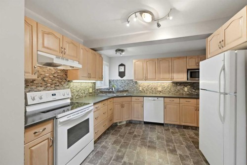 8 Sydney Close, Red Deer, AB - Indoor Photo Showing Kitchen With Double Sink