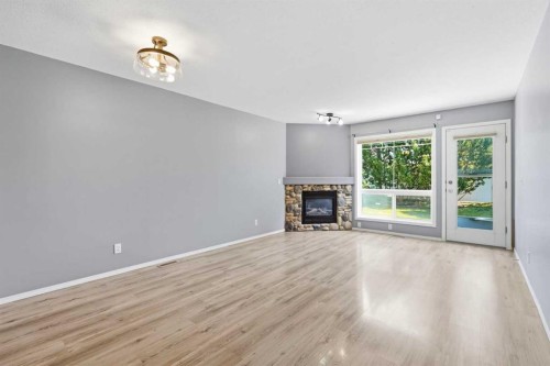 3 Janko Close, Red Deer, AB - Indoor Photo Showing Living Room With Fireplace
