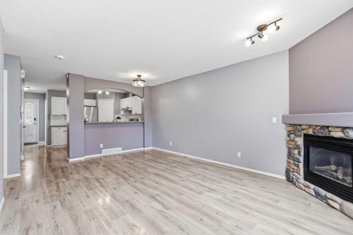 3 Janko Close, Red Deer, AB - Indoor Photo Showing Living Room With Fireplace