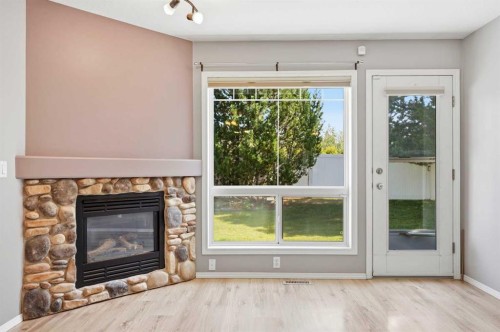 3 Janko Close, Red Deer, AB - Indoor Photo Showing Living Room With Fireplace