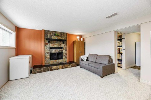 65 Hart Crescent South, Red Deer, AB - Indoor Photo Showing Living Room With Fireplace