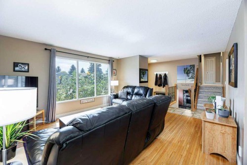65 Hart Crescent South, Red Deer, AB - Indoor Photo Showing Living Room With Fireplace