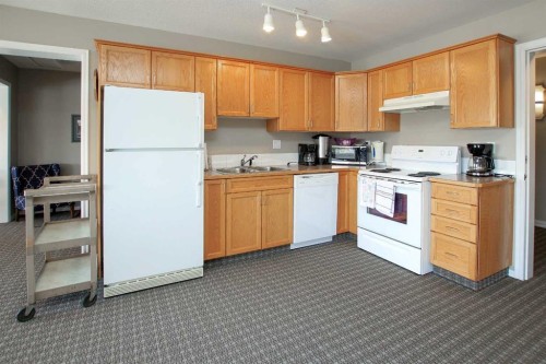 409-6118 53 Avenue, Red Deer, AB - Indoor Photo Showing Kitchen With Double Sink