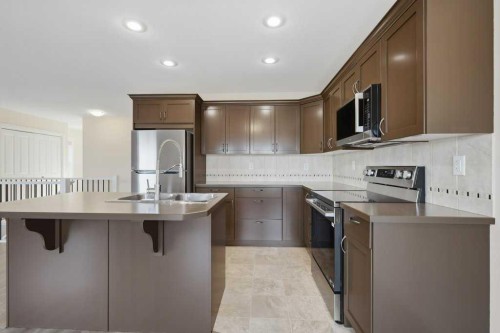 93 Valley Crescent, Blackfalds, AB - Indoor Photo Showing Kitchen With Double Sink With Upgraded Kitchen
