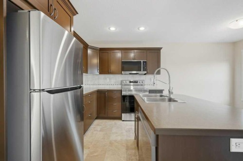 93 Valley Crescent, Blackfalds, AB - Indoor Photo Showing Kitchen With Double Sink