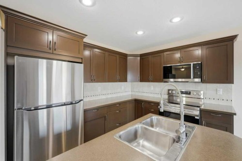 93 Valley Crescent, Blackfalds, AB - Indoor Photo Showing Kitchen With Double Sink