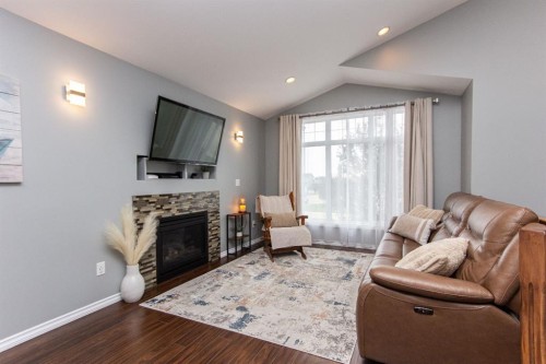 52 Almond Crescent, Blackfalds, AB - Indoor Photo Showing Living Room With Fireplace