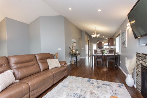 52 Almond Crescent, Blackfalds, AB - Indoor Photo Showing Living Room With Fireplace