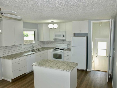 68 Hermary, Red Deer, AB - Indoor Photo Showing Kitchen With Double Sink