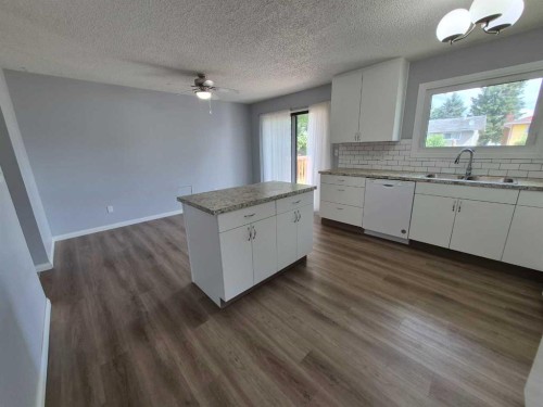 68 Hermary, Red Deer, AB - Indoor Photo Showing Kitchen With Double Sink
