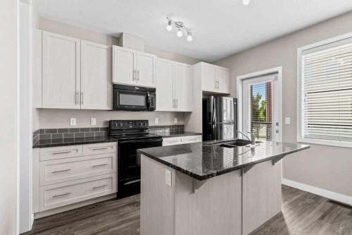 702-125 Caribou Crescent, Red Deer, AB - Indoor Photo Showing Kitchen