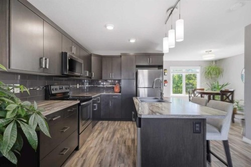 9 Hampton Crescent, Sylvan Lake, AB - Indoor Photo Showing Kitchen With Double Sink With Upgraded Kitchen