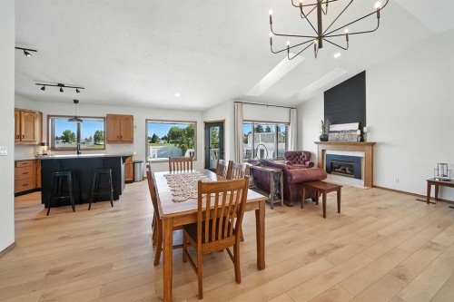 14 Denison Crescent, Red Deer, AB - Indoor Photo Showing Dining Room With Fireplace