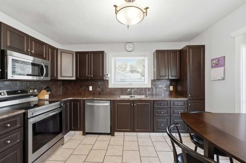 4814 Lorne Avenue, Blackfalds, AB - Indoor Photo Showing Kitchen With Double Sink