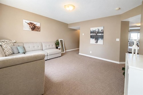 63 Hawkridge Boulevard, Penhold, AB - Indoor Photo Showing Living Room