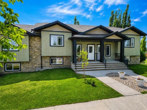 63 Hawkridge Boulevard, Penhold, AB - Outdoor With Facade