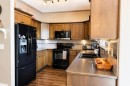 63 Hawkridge Boulevard, Penhold, AB  - Indoor Photo Showing Kitchen With Double Sink 