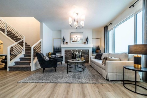 468 Northern Lights Place, Langdon, AB - Indoor Photo Showing Living Room With Fireplace