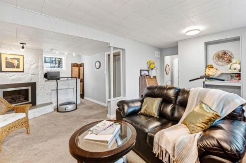 21 Malcolm Crescent, Red Deer, AB - Indoor Photo Showing Living Room With Fireplace