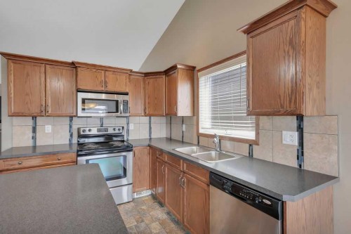 12 Kensington Close, Red Deer, AB - Indoor Photo Showing Kitchen With Double Sink