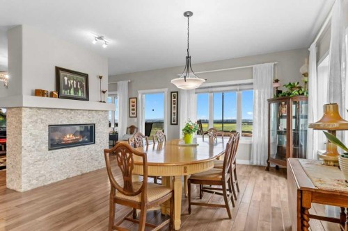 36408 Range Road 271, Rural Red Deer County, AB - Indoor Photo Showing Dining Room With Fireplace