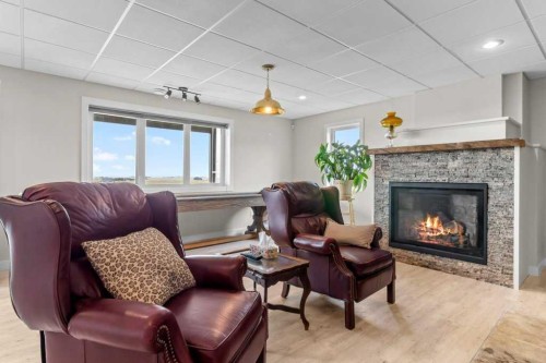 36408 Range Road 271, Rural Red Deer County, AB - Indoor Photo Showing Living Room With Fireplace