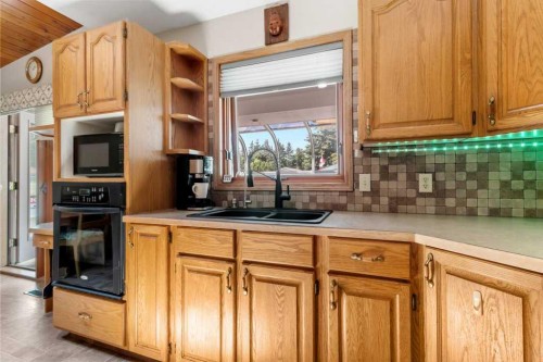 4732 48 Street, Sylvan Lake, AB - Indoor Photo Showing Kitchen With Double Sink