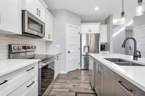 22 Bardwell Way, Sylvan Lake, AB - Indoor Photo Showing Kitchen With Double Sink With Upgraded Kitchen