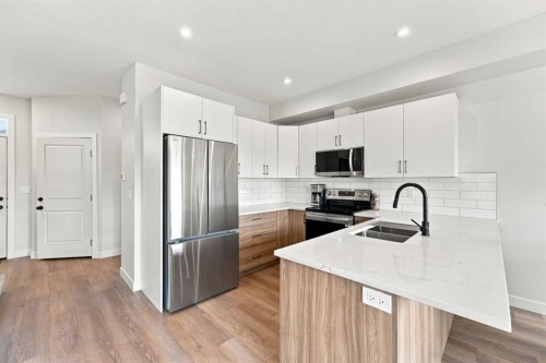 41 Pinnacle Close, Blackfalds, AB - Indoor Photo Showing Kitchen With Stainless Steel Kitchen With Double Sink With Upgraded Kitchen