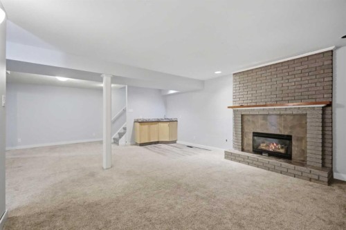 5910 57 Ave, Ponoka, AB - Indoor Photo Showing Other Room With Fireplace