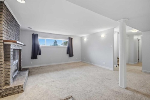 5910 57 Ave, Ponoka, AB - Indoor Photo Showing Other Room With Fireplace