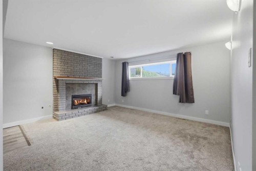 5910 57 Ave, Ponoka, AB - Indoor Photo Showing Living Room With Fireplace