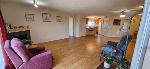 406-4425 Heritage Way, Lacombe, AB - Indoor With Fireplace