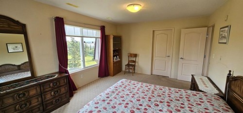 406-4425 Heritage Way, Lacombe, AB - Indoor Photo Showing Bedroom