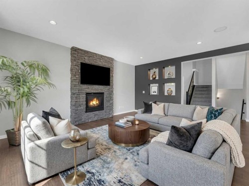 25 Lazaro Close, Red Deer, AB - Indoor Photo Showing Living Room With Fireplace