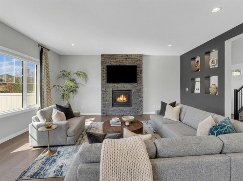 25 Lazaro Close, Red Deer, AB - Indoor Photo Showing Living Room With Fireplace