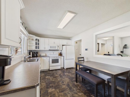 26 Otterbury Avenue, Red Deer, AB - Indoor Photo Showing Kitchen With Double Sink