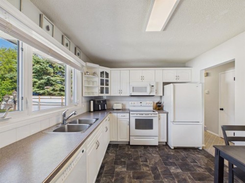 26 Otterbury Avenue, Red Deer, AB - Indoor Photo Showing Kitchen With Double Sink