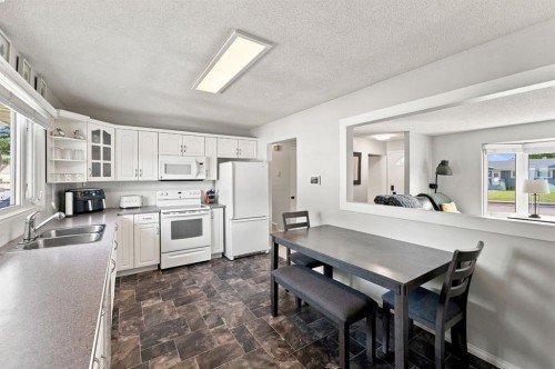 26 Otterbury Avenue, Red Deer, AB - Indoor Photo Showing Kitchen With Double Sink