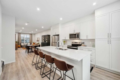232 Vantage Drive, Cochrane, AB - Indoor Photo Showing Kitchen With Stainless Steel Kitchen With Double Sink With Upgraded Kitchen